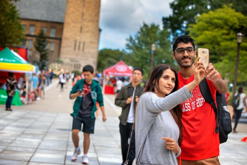 Students taking a selfie with their phones