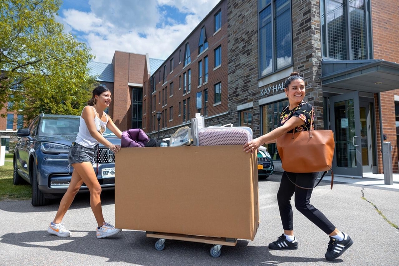 Students pushing big box