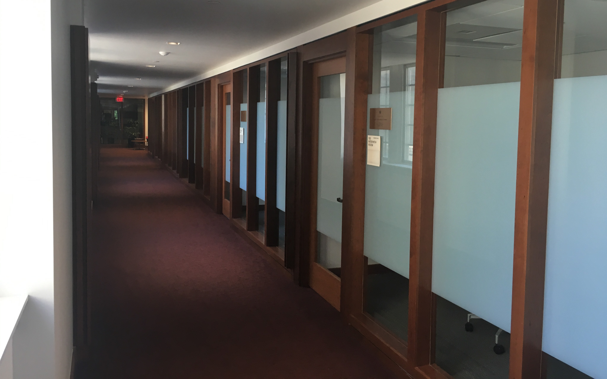 Hallway interior within Hughes Hall utilizing natural lighting