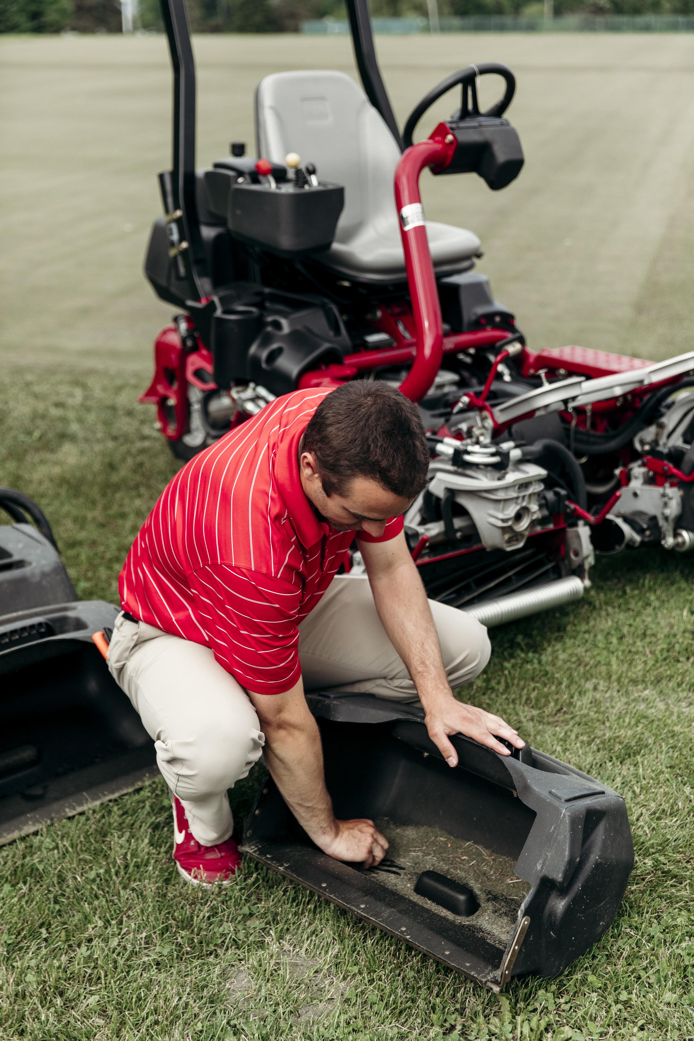 Pulling grass from the mower