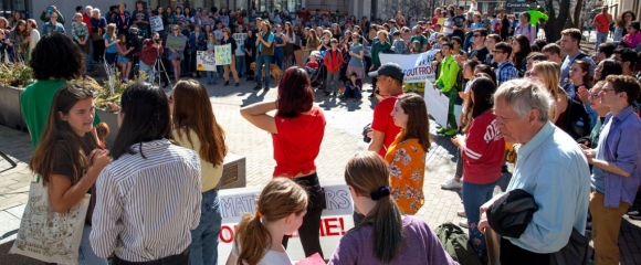 Large group of activists with climate justice signs