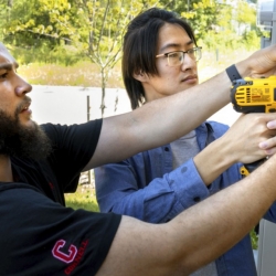 Doctoral candidate Alfredo Rodriguez, and Qingxuan Sun, a visiting Ph.D., install an Internet of Things-based outdoor air quality monitor