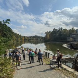 A group gathers next to Beebe Lake to celebrate the hydroplant relicensing