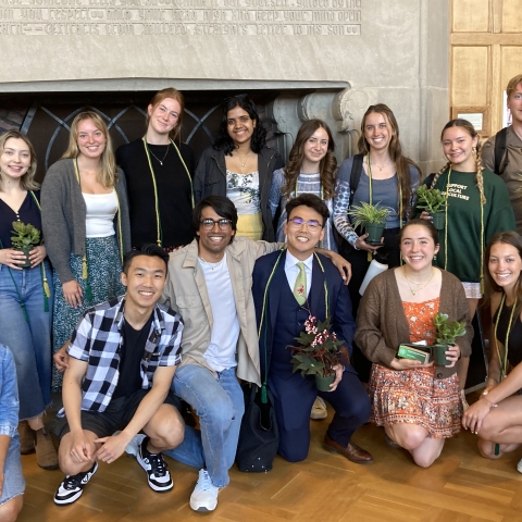 students standing together with awards