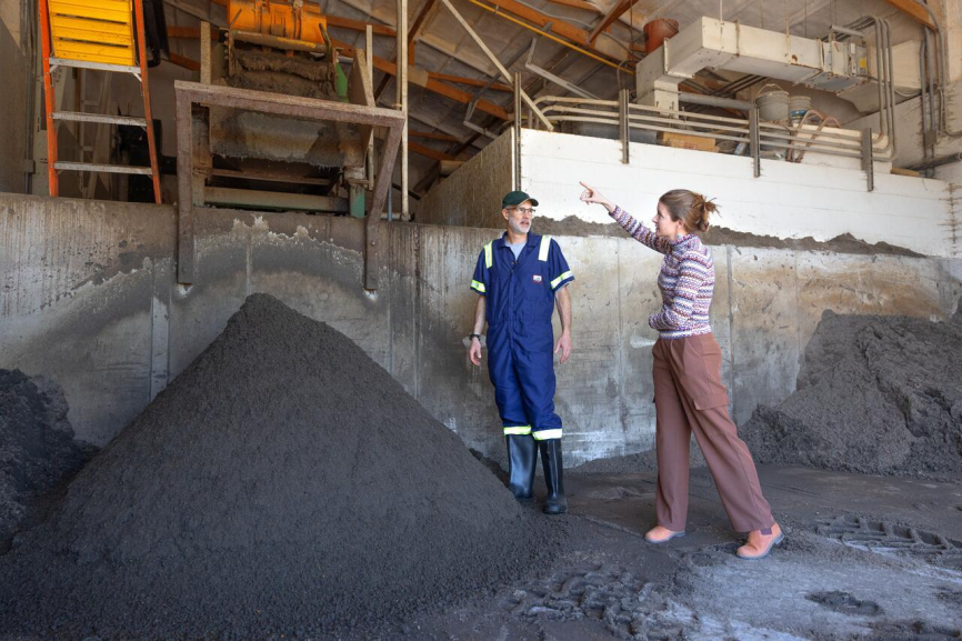 People discussing biodigester at Cornell.