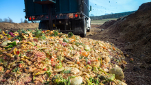 A truck dumps food waste at the Cornell Composting Facility.