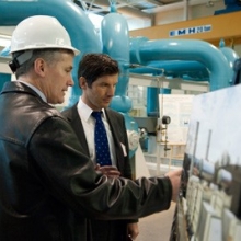 Sierra Club's Beyond Coal Director Bruce Nilles, right, talks with Frank Perry, Cornell Combined Heat and Power Plant associate project manager, at the Lake Source Cooling Plant.