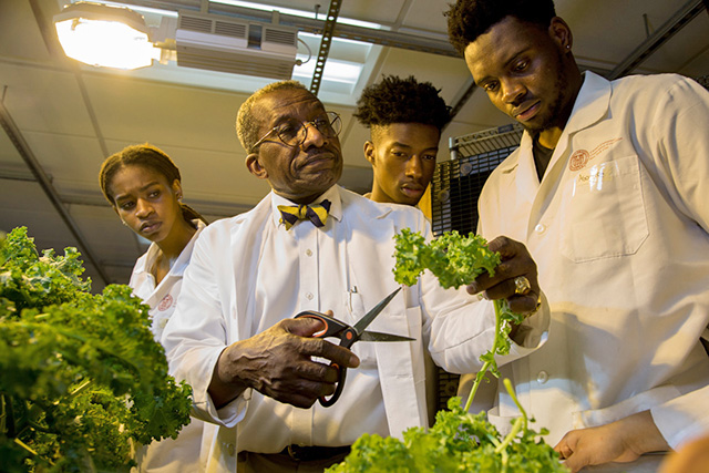 The Big Red Bear pauses for a photo with his adoring fans.